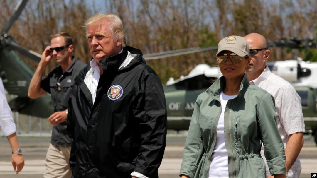 President Donald Trump and first lady Melania Trump walk after arrival at the Luis Muñiz Air National Guard Base in San Juan, Puerto Rico, Oct. 3, 2017. 