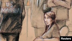 FILE - Yujing Zhang, charged with bluffing her way into President Donald Trump's Florida resort, is seated upon arrival with U.S. Marshals, awaiting the start of her hearing at the U.S. federal court in this courtroom sketch, in West Palm Beach, Florida, April 8, 2019.
