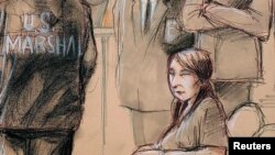 FILE - Yujing Zhang, charged with bluffing her way into President Donald Trump's Florida resort, awaits the start of her hearing at the U.S. federal court in this courtroom sketch, in West Palm Beach, Florida, April 8, 2019.