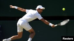 Serbia's Novak Djokovic in action at Wimbledon during the men's singles final against South Africa's Kevin Anderson, July 15, 2018. 