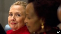  Clinton looks toward South Africa's Foreign Minister Maite Nkoana-Mashabane, during the US-South Africa Business Partnership Summit in Pretoria, South Africa, Tuesday, Aug. 7, 2012.