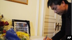 In this file photo - Yap Kimtung, president of Cambodian American for Human Rights and Democracy, signed in at the Cambodian embassy, located in Washington, DC.