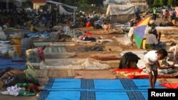 Displaced refugees are seen in a camp at Mpoko international airport in Bangui, Central African Republic, Dec. 15, 2013.