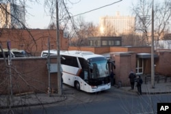 Buses believed to be carrying expelled diplomats leave the U.S. Embassy in Moscow, Russia, April 5, 2018. Russia last week ordered 60 American diplomats to leave the country by Thursday, in retaliation for the United States expelling the same number of Ru