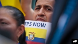 FILE - A supporter among a coalition of community leaders and immigrant advocates demonstrates outside U.S. immigration offices, calling on federal authorities to designate Ecuador for Temporary Protected Status (TPS) for its nationals in the aftermath of an earthquake, June 2, 2016.
