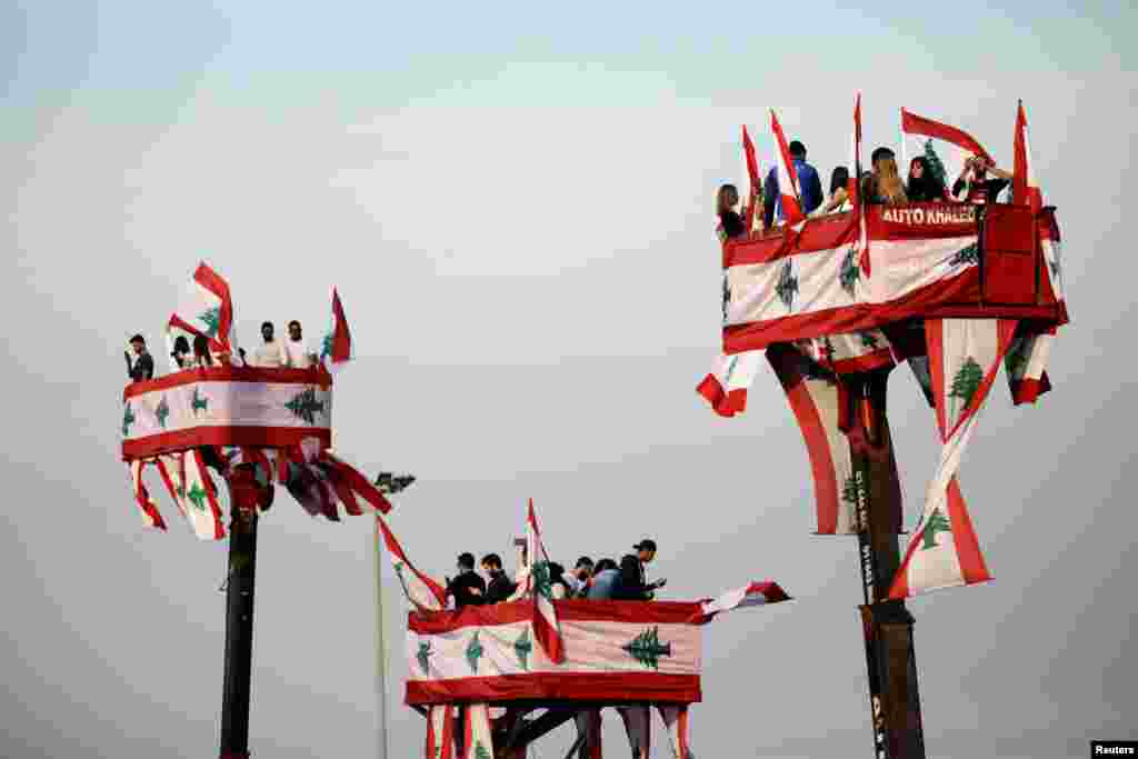 People take part in a parade, on the 76th anniversary of Lebanon&#39;s independence, from a crane platform at Martyrs&#39; Square in Beirut, Lebanon.