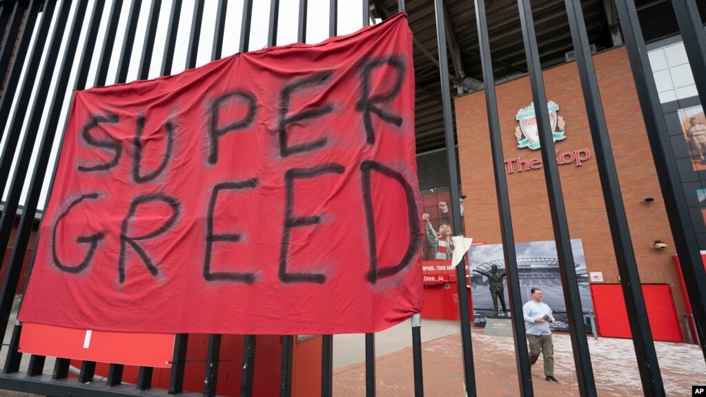 FILE - In this file photo dated Wednesday, April 21, 2021, a protest banner against the proposed Super League is seen outside Liverpool's Anfield Stadium after the collapse of English involvement in the proposed new league, Liverpool, England. 