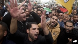 Palestinian mourners carry the body of Ibrahim Skafi, 22, during his funeral in the West Bank city of Hebron, Thursday, Nov. 5, 2015. President Obama will host Israeli Prime Minister Benjamin Netanyahu at the White House on Monday.