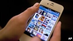 Instagram is demonstrated on an iPhone, in New York. (AP Photo/Karly Domb Sadof, File)