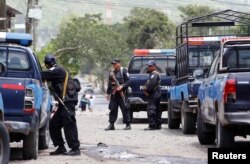 Members of Nicaragua's Special Forces patrol the streets after clashes with anti-government protesters in the Sandino neighborhood in Jinotepe, Nicaragua, July 24, 2018.