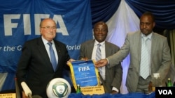 ZIFA president Cuthbert Dube (center) beat his rivals hands down in a poll Saturday 