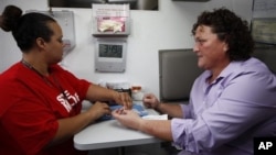 A woman in Los Angeles gets an HIV test.