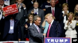 Republican presidential candidate Donald Trump welcomes Nigel Farage, left, ex-leader of the British UKIP party, to speak at a campaign rally in Jackson, Miss., Wednesday, Aug. 24, 2016.