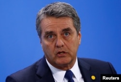 Roberto Azevedo, Director-General of the World Trade Organization (WTO), attends a news conference with representatives of the trade organizations after a meeting in the chancellery in Berlin, Germany, June 11, 2018.