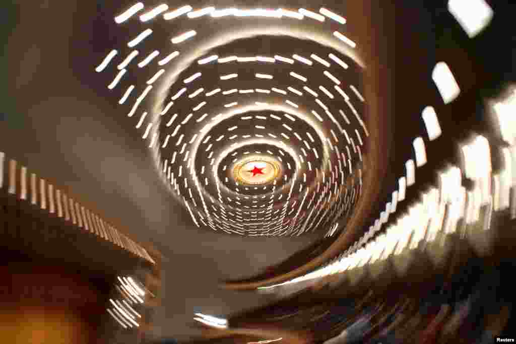 A red light in the shape of a five-pointed star is seen among the lights on the ceiling of the Great Hall of the People during the second plenary session of the National People&#39;s Congress (NPC) in Beijing, China.