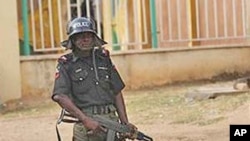 A policeman stands guard in Kaduna, Nigeria, April 21, 2011