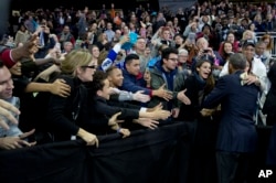President Obama greets people in the audience after speaking at University of Nebraska-Omaha, Jan. 13, 2016.
