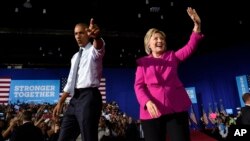 President Barack Obama and Democratic presidential candidate Hillary Clinton wave upon arriving at a campaign event at the Charlotte Convention Center in Charlotte, N.C., Tuesday, July 5, 2016. Obama is spending the afternoon campaigning for Clinton. (AP Photo/Susan Walsh)