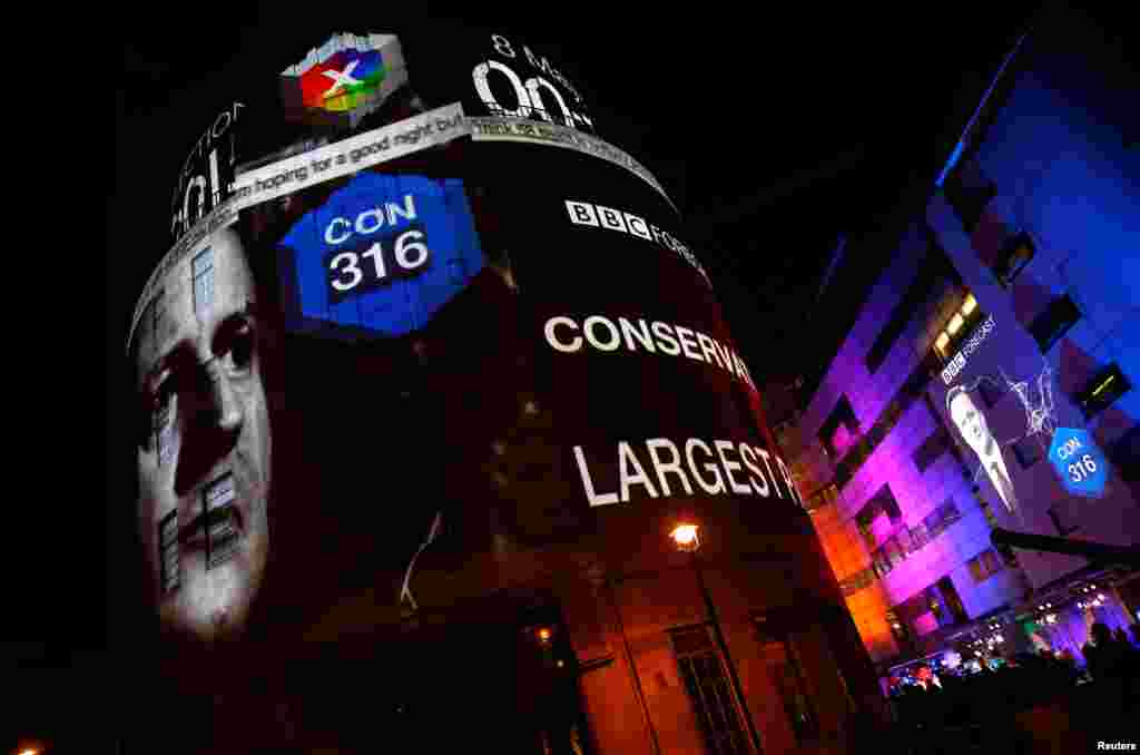The results of exit polls are projected on to the side of Broadcasting House, the headquarters of the BBC, after voting closed in Britain&#39;s general election, in central London.