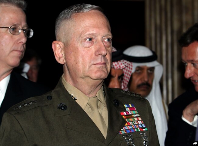 U.S. Gen. James Mattis, commander of U.S. Central Command, walks with other delegates, Dec. 4, 2010, at the International Institute for Strategic Studies' global security forum in Manama, Bahrain.