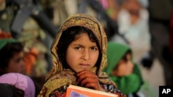 A contemplative student at a school in Marjah, Helmand Province, Afghanistan, on Sunday, March 20, 2011. (S.K. Vemmer/Department of State)