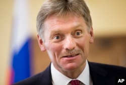 FILE - President Vladimir Putin’s spokesman, Dmitry Peskov, speaks to The Associated Press in Moscow, April 5, 2016. Peskov says the Russian leader has no connection whatsoever to offshore accounts mentioned in the so-called Panama Papers.