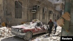 After an air strike in the rebel-held besieged al-Qaterji neighborhood of Aleppo, Syria October 17, 2016.