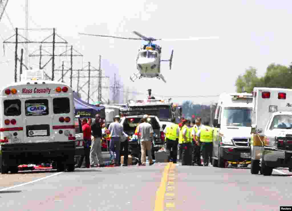A Medevac helicopter lands at a triage center set up on highway LA 3115 near the Williams Olefins chemical plant, after an explosion and fire there, in Geismar, Louisiana, USA, June 13, 2013. An explosion and fire tore through the chemical plant, injuring 33 people and leading authorities to order people within two miles (3 km) to remain indoors.