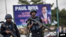 FILE - Members of Cameroon's security forces patrol in the South West province capital Buea, Oct. 3, 2018.