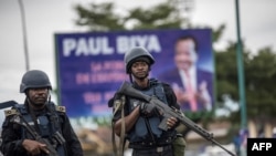 FILE - Members of Cameroon's security forces patrol in the Southwest province capital Buea, Oct. 3, 2018.