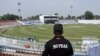 A Police Elite Force member stands guard at Rawalpindi Cricket Stadium, after the New Zealand team pulled out of a Pakistan tour over security concerns, in Rawalpindi, Sept. 17, 2021.