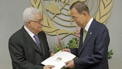 Palestinian President Mahmoud Abbas, left, gives a letter requesting recognition of Palestine as a state to Secretary-General Ban Ki-moon during the 66th session of the General Assembly at United Nations headquarters Friday.