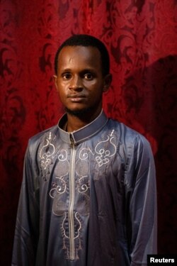 FILE - Mamadou Safaiou Barry poses for a photograph at his new home in El Marg district in the east of Cairo, Egypt, September 23, 2023.