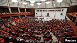 Turkish lawmakers vote a bill that allows troop deployment to Libya, at the Parliament in Ankara, Turkey, Jan. 2, 2020. 