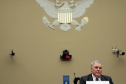 FILE - Internal Revenue Service Commissioner Charles Rettig testifies at a House Committee on Oversight and Reform hearing, in Washington, Oct. 7, 2020.