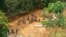 Indian Army soldiers dig at the site of a mudslide as they look for bodies of missing people in Tamenglong district, in the northeastern Indian state of Manipur, July 11, 2018.