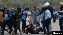 FILE PHOTO: Supporters of former Pakistani PM Imran Khan clash with police in Islamabad