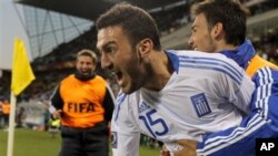 Greece's Vassilis Torosidis elebrates after scoring during the World Cup group B soccer match between Greece and Nigeria at Free State Stadium in Bloemfontein, South Africa, 17 Jun 2010