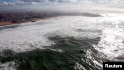 FILE - An aerial view shows breaking waves along the ocean beach front in Biarritz on the southern Atlantic Coast of France, Feb. 5, 2014. 