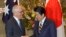 Australian Prime Minister Malcolm Turnbull, left, shakes hands with his Japanese counterpart Shinzo Abe prior to a meeting at Abe's official residence in Tokyo, Jan. 18, 2018. 