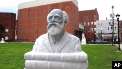 FILE - A sculpture of Henry Martin Freeman, the first Black American college president, is on display in his home city of Rutland, Vt., Nov. 23, 2020. 