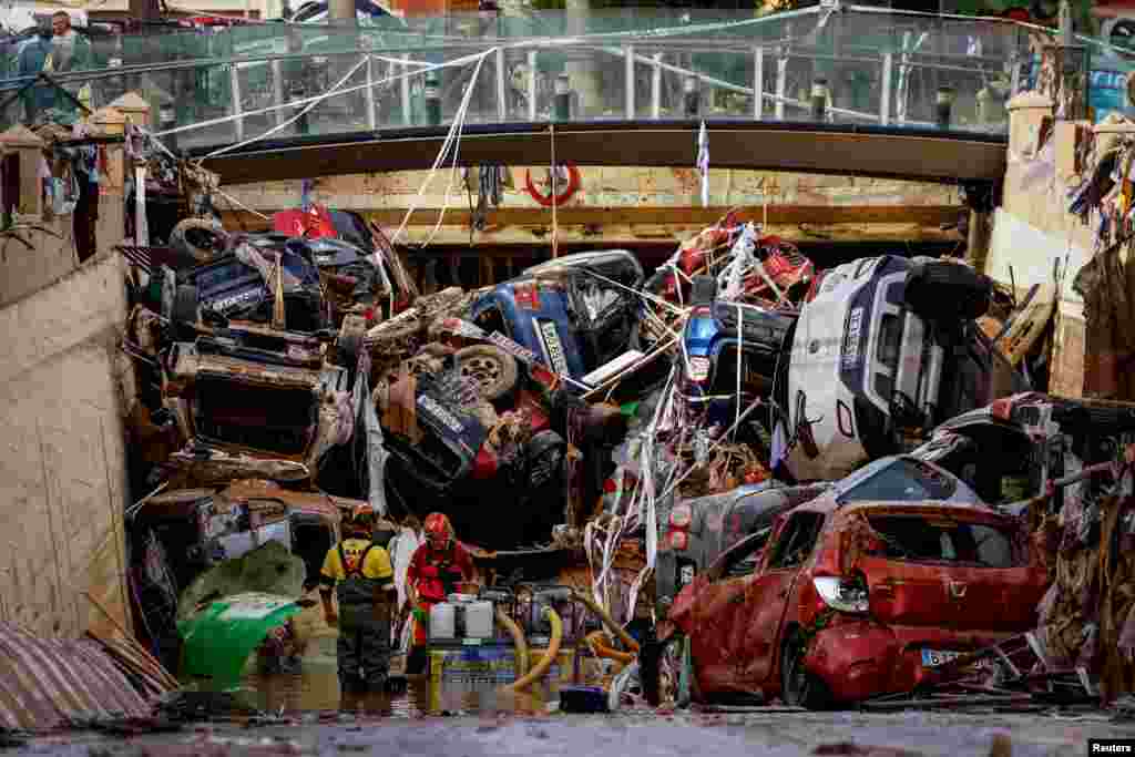 Firefighters pump out the floodwater out of a tunnel where vehicles are piled up, after heavy rains in Alfafar, in Valencia, Spain, Nov. 1, 2024. The deadly floods on Oct. 29 killed over 220 people in eastern Spain. Torrential rains and flooding drowned people in cars and underground car parks, and collapsed homes.