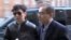 FILE - Thae Yong Ho, right, escorts North Korean leader Kim Jong Un's elder brother, Kim Jong Chol, to an Eric Clapton concert in London in 2015, in this image from Japanese TBS TV. Thae has defected to South Korea, Seoul officials say.