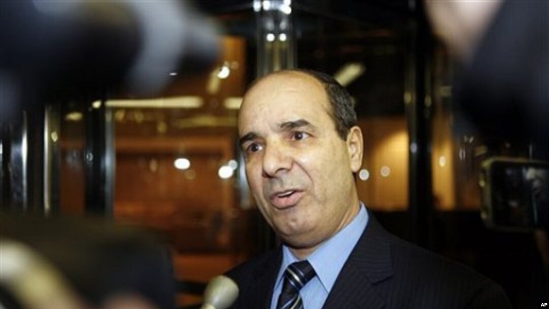 Ibrahim Dabbashi, Libya's deputy ambassador at the United Nations, speaks to reporters at the entrance to the Libyan Mission in New York February 21, 2011