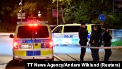 FILE - Police stand near the Israeli embassy after a suspected shooting nearby in Stockholm, Sweden, Oct. 1, 2024. Police said, Oct. 10, 2024, they were investigating a shooting near an Israeli target in Gothenburg city. (TT News Agency/Anders Wiklund via Reuters)