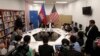 U.S. Ambassador to Cambodia William Heidt, rear center, gives a press conference at the U.S. Embassy in Phnom Penh, Cambodia, Tuesday, Sept. 12, 2017. Heidt has delivered a sharp response to allegations by Prime Minister Hun Sen that Washington is seeking to dislodge his government, denying the allegations and warning that Cambodia is doing itself damage international with its anti-American campaign. (AP Photo/Heng Sinith)