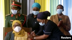 Tanzania's President Samia Suluhu Hassan receives her Johnson & Johnson vaccine against the coronavirus disease (COVID-19) at State House in Dar es Salaam, Tanzania, July 28, 2021.