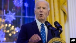 FILE - President Joe Biden speaks during a Hanukkah reception in the East Room of the White House in Washington, Dec. 16, 2024.