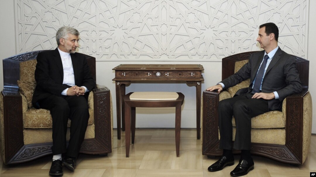Foto yang dirilis oleh kantor berita resmi Suriah, SANA, menunjukkan foto kunjungan Sekretaris Dewan Keamanan Nasional Iran, Saeed Jalili ke Damaskus, menemui Presiden Bashar al-Assad (7/8).