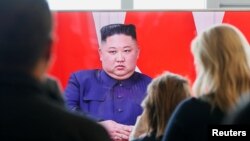 Members of the media watch the broadcast of the meeting between North Korean leader Kim Jong Un and Russia's President Vladimir Putin (not pictured) on the Far Eastern Federal University campus at Russky Island in the far eastern city of Vladivostok, Russia, April 25, 2019.